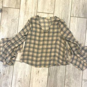 Adorable lightweight blouse purchased from a local boutique. Brand new.